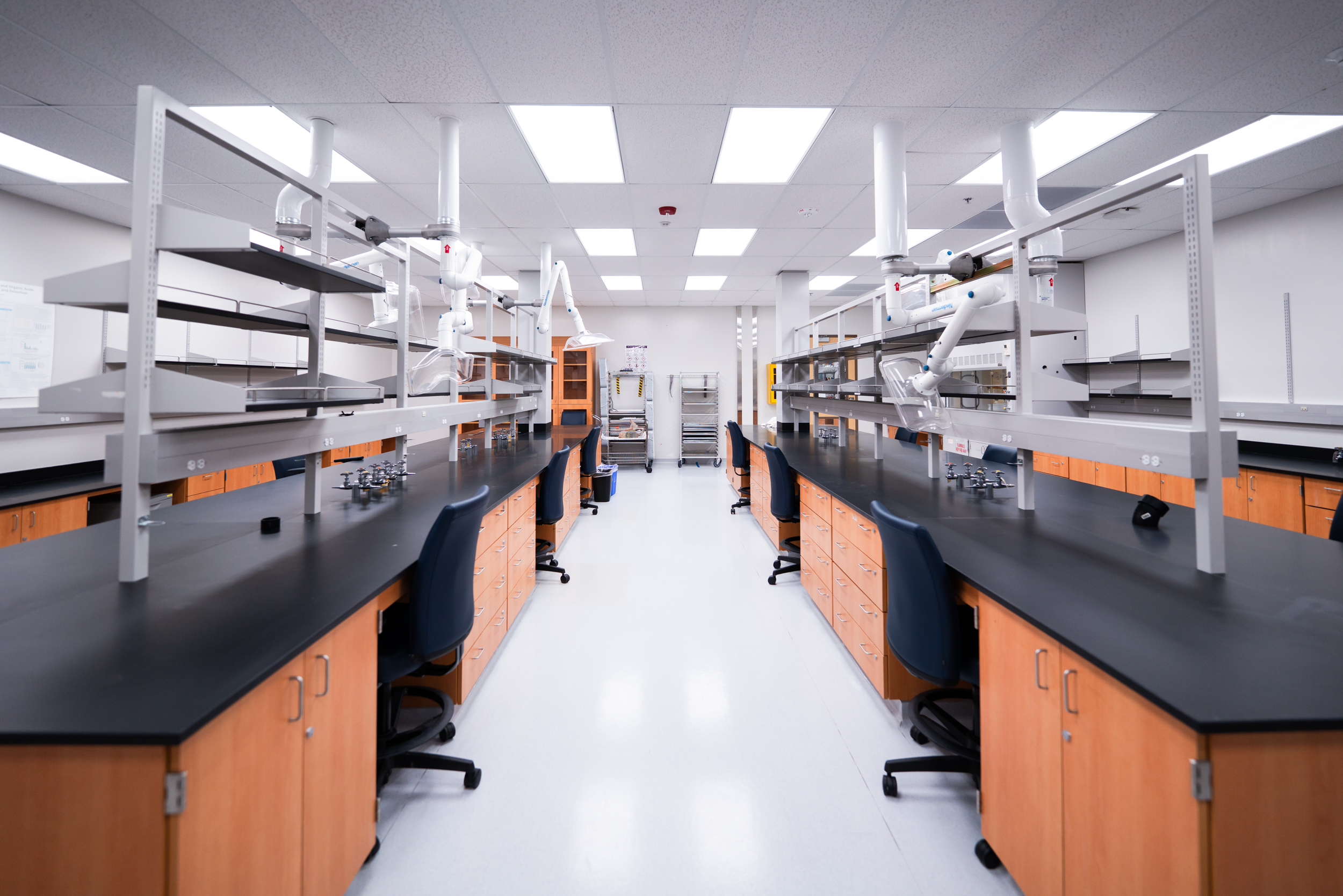 An empty lab with rows of chairs.